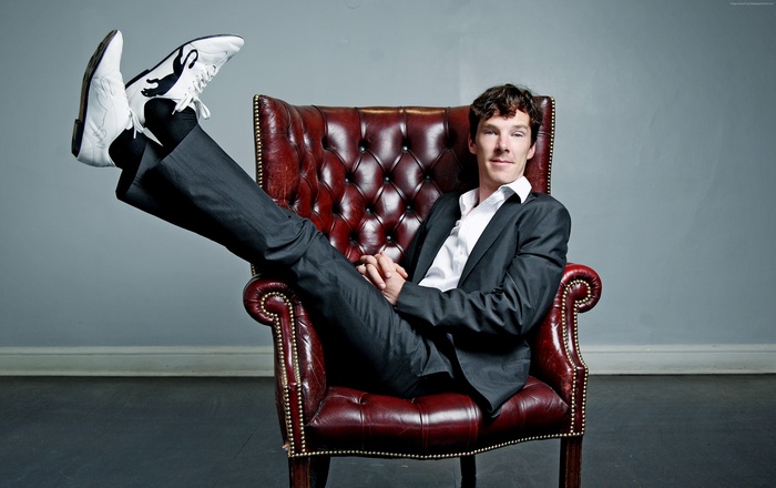 Benedict Cumberbatch sitting in a leather armchair