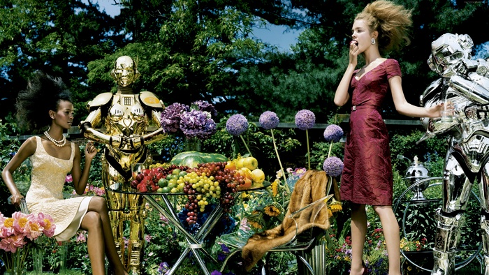 Liya Kebede and Natalia Vodianova with robots in a garden