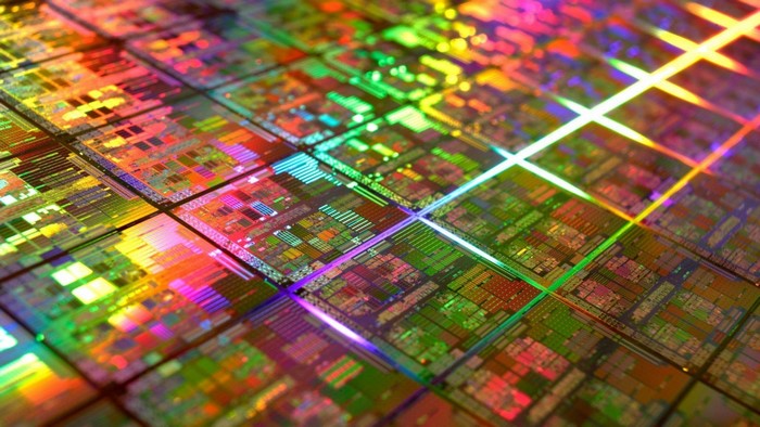 Close-up of a silicon wafer with colorful reflections