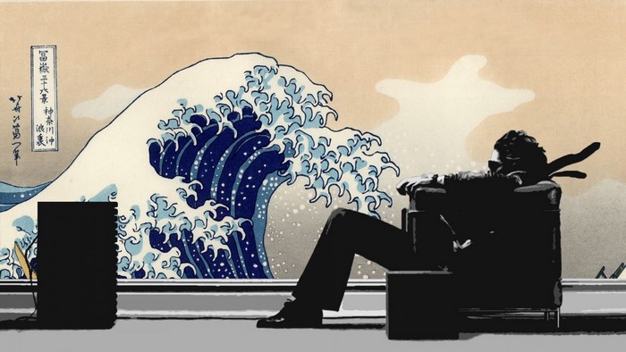 Man relaxing in chair with The Great Wave off Kanagawa