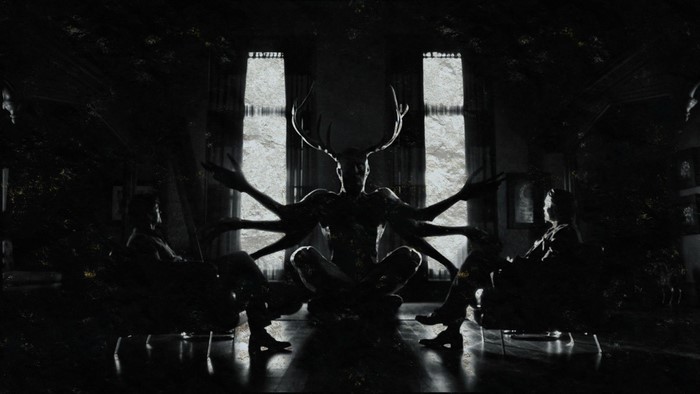 Hannibal Lecter with a multi-armed deer-like creature