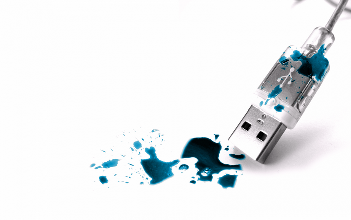 USB drive with blue ink splatters
