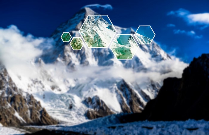 Hexagons overlaying a snow-covered mountain range