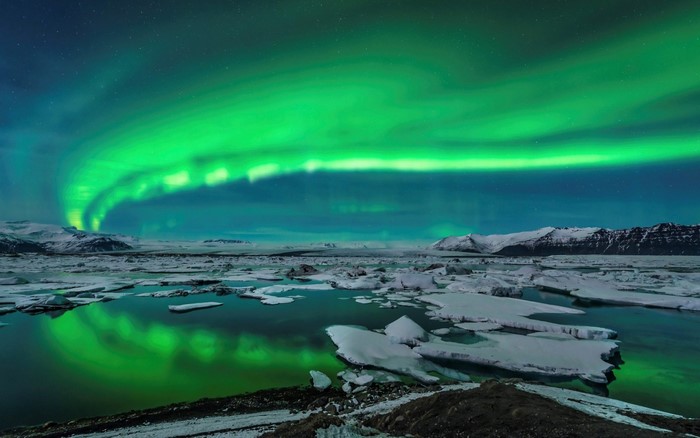 Aurora Borealis over Iceland's glacial lagoon