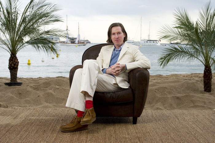 Wes Anderson sitting on a beach chair