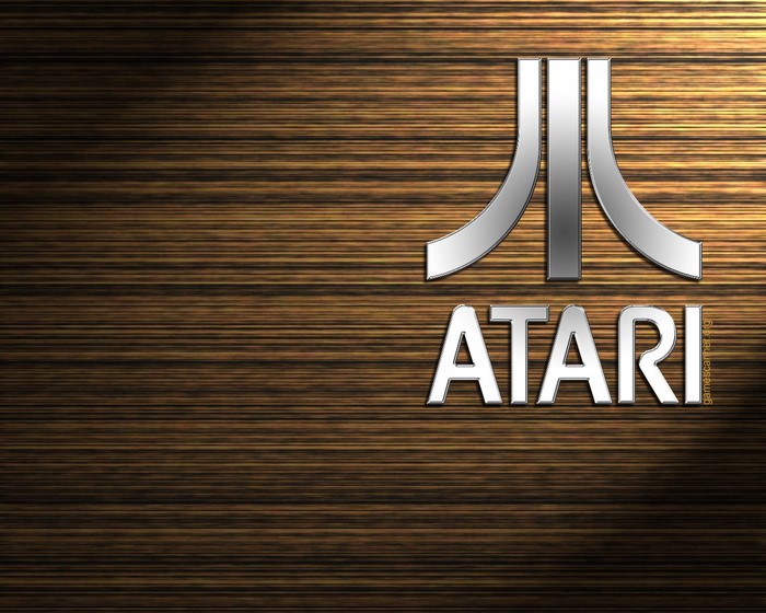 Atari logo and text on a wooden background