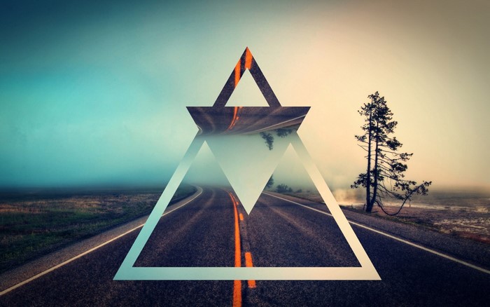 Geometric overlay on a foggy road at sunrise