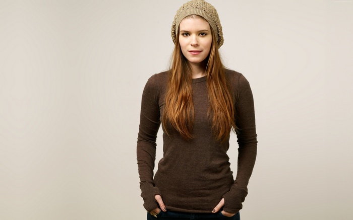 Kate Mara wearing a beanie and brown shirt