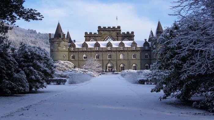 Snowy winter landscape with a castle in Scotland