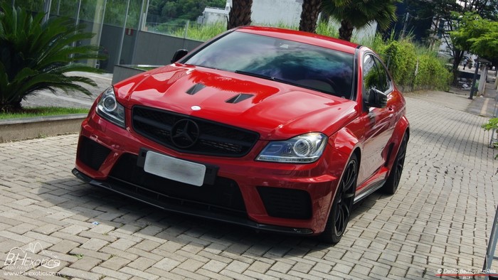 Red Mercedes-Benz C-Class Coupe on a Cobblestone Driveway