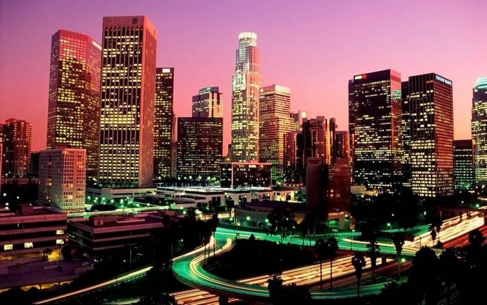 Downtown Los Angeles skyline at dusk with light trails