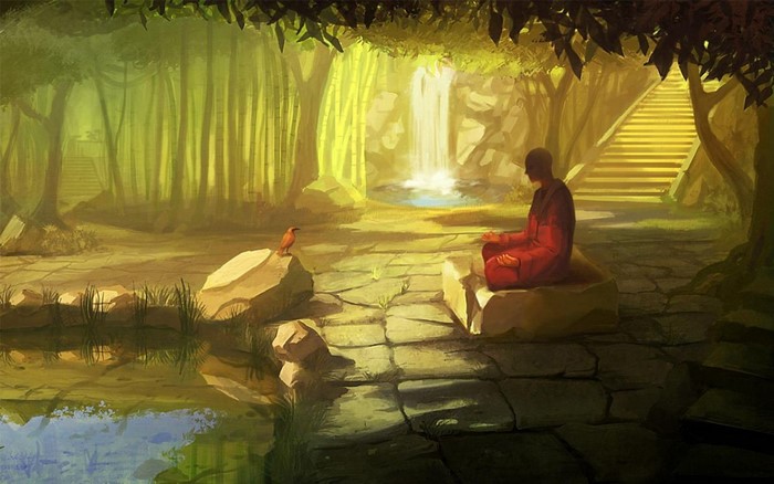 Monk meditating by waterfall in jungle
