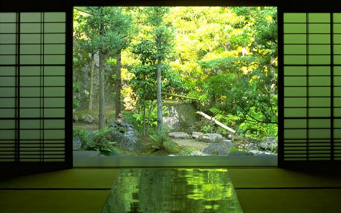 View of a Japanese garden through a shoji screen