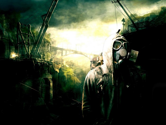 Man in gas mask in apocalyptic industrial landscape