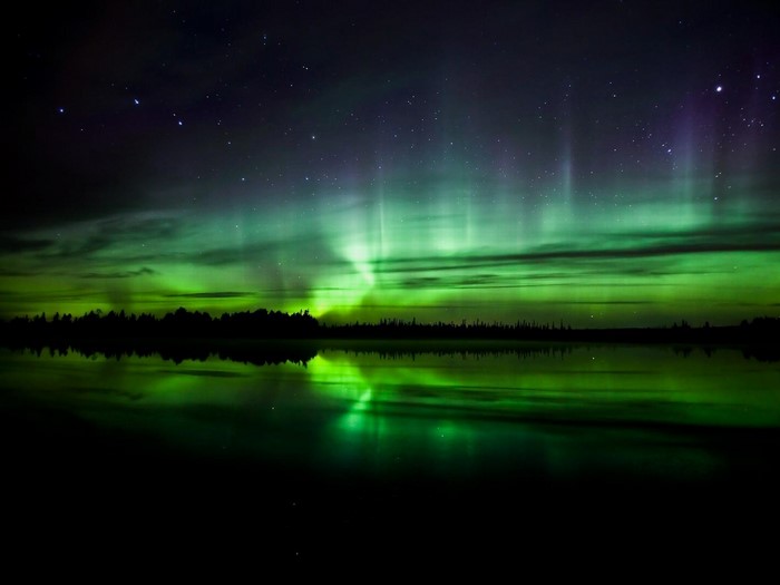 Aurora Borealis over a lake at night