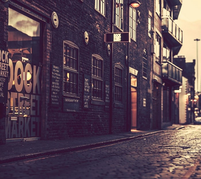 Dock Street Market building facade and cobblestone street