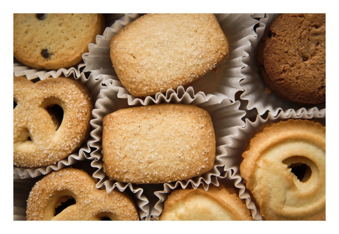 Assortment of butter cookies in paper liners