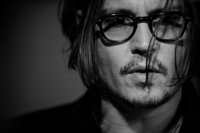 Johnny Depp wearing glasses and beard