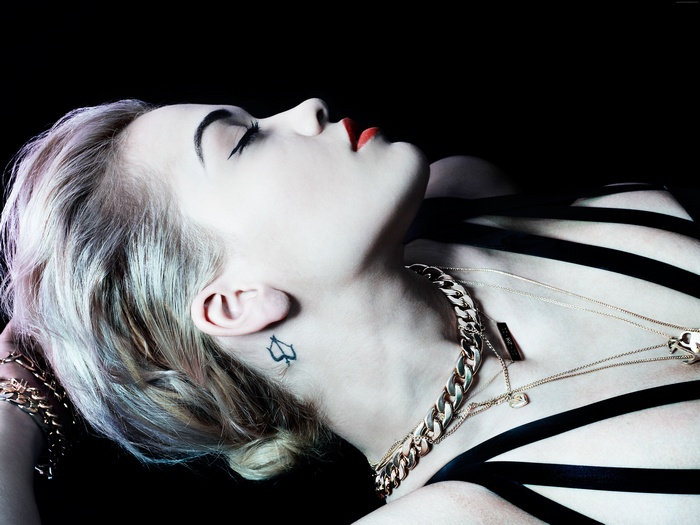 Rita Ora with tattoos and jewelry