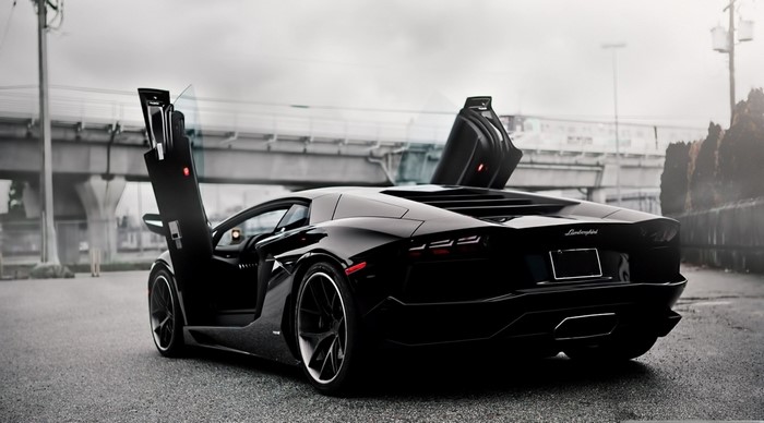 Black Lamborghini Aventador with doors open