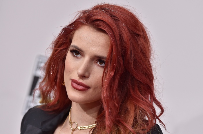 Bella Thorne with red hair and glitter