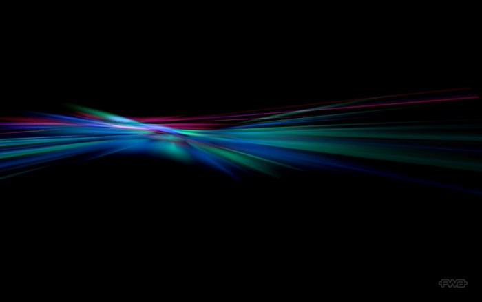 Abstract light streaks in blue, green, and pink on black