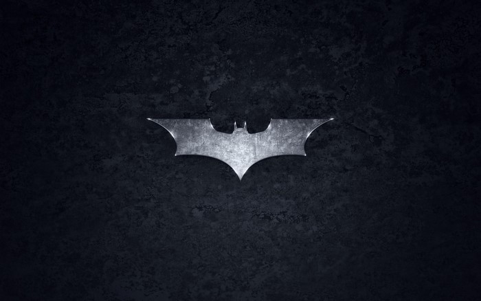 Batman logo on a dark textured background