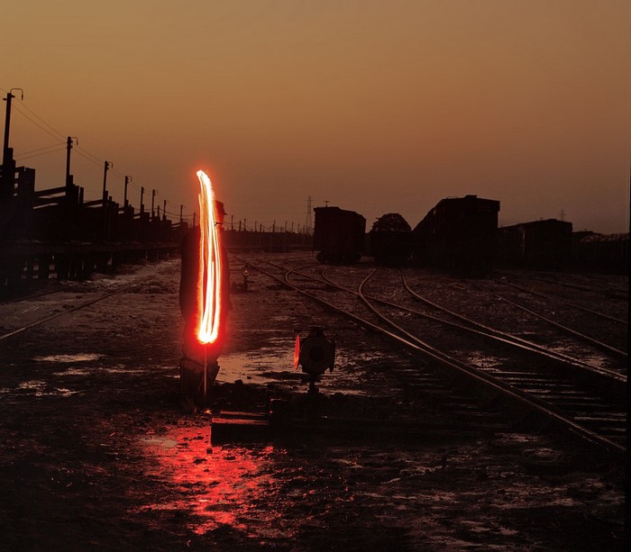 Train yard at dusk with light painting