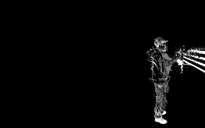 Graffiti artist with spray can on black background