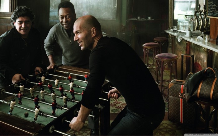 Pelé, Maradona, and Zidane playing foosball