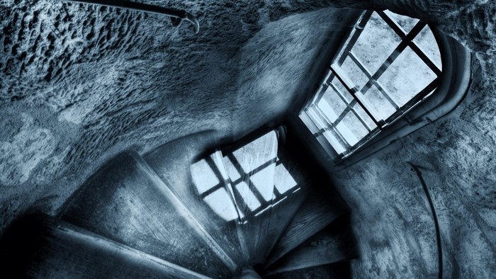 Spiral Staircase with Window Reflections