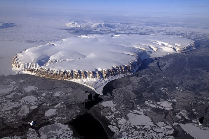 Aerial view of a snow-covered island in the Arctic Ocean