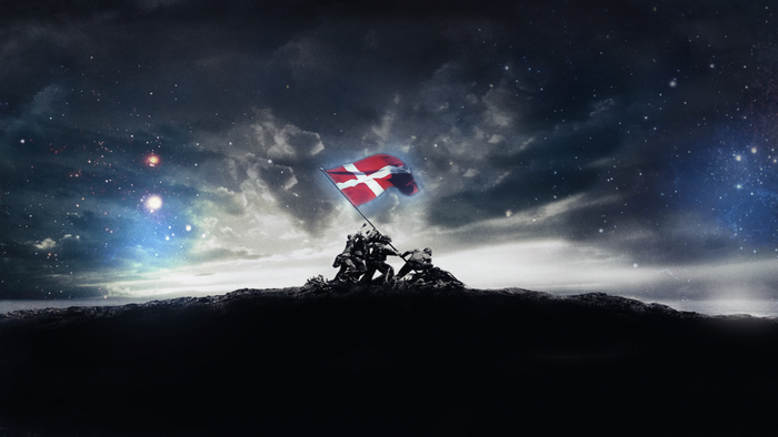 Danish flag raised on a mountain under a starry night sky