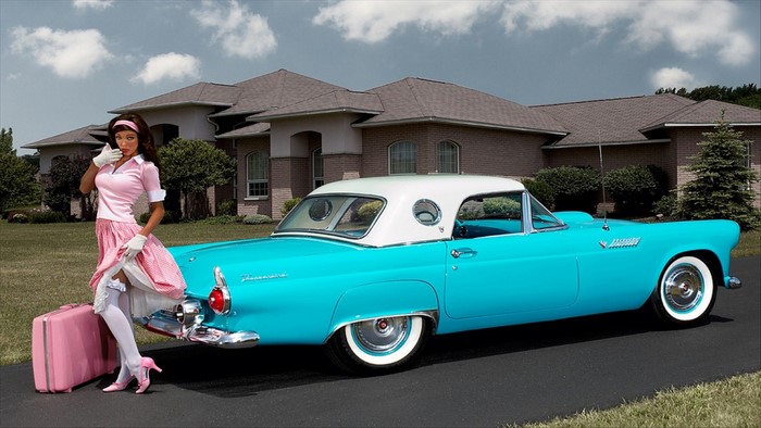 Pinup model with vintage turquoise Ford Thunderbird