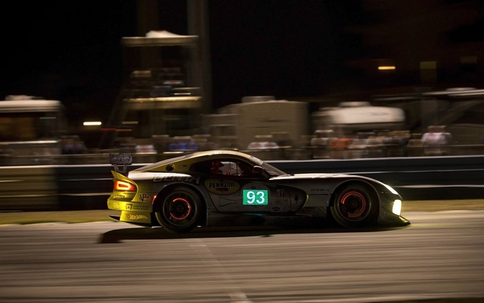 Dodge Viper race car with number 93 on track at night