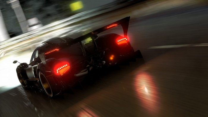 Pagani Zonda R driving on a wet road at night