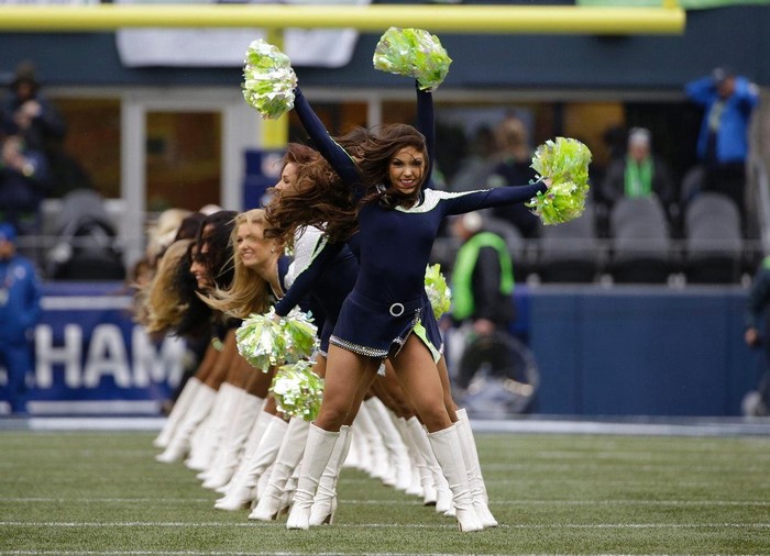 Seattle Seahawks cheerleaders performing on a football field