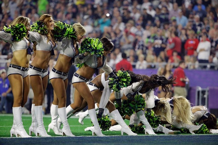 Seattle Seahawks cheerleaders performing on a football field