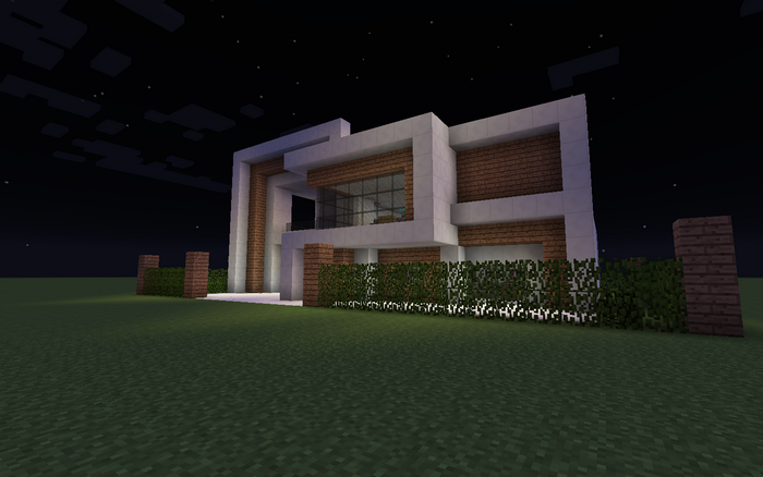 Modern Minecraft house at night with hedge fence