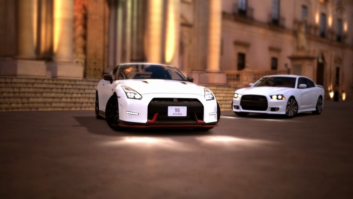 Nissan GT-R and Dodge Charger in front of building
