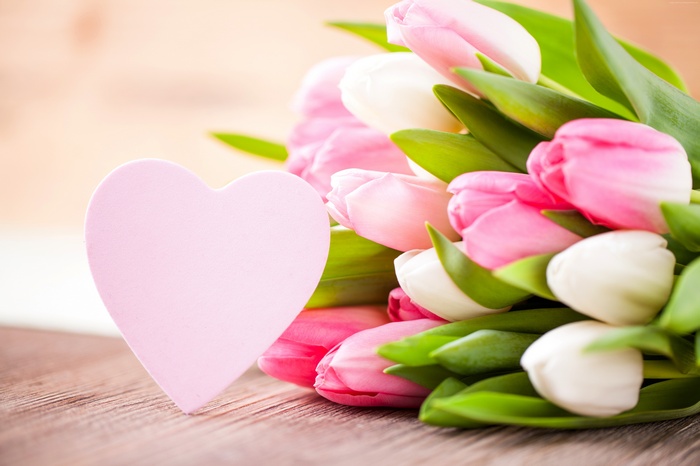 Pink and white tulips with a heart decoration