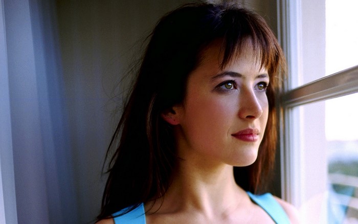 Sophie Marceau looking out a window