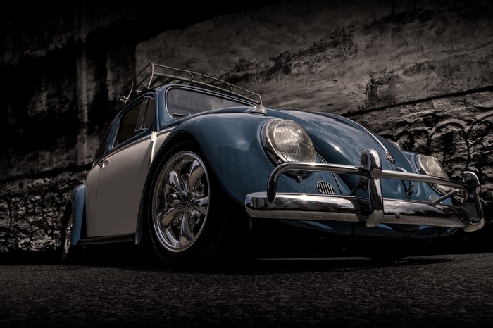 Blue and white Volkswagen Beetle with roof rack