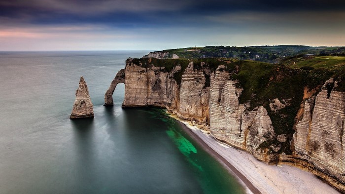 Etretat cliffs and sea arch in Normandy, France