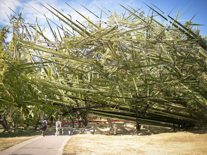 Glitch art of trees and sky with people walking