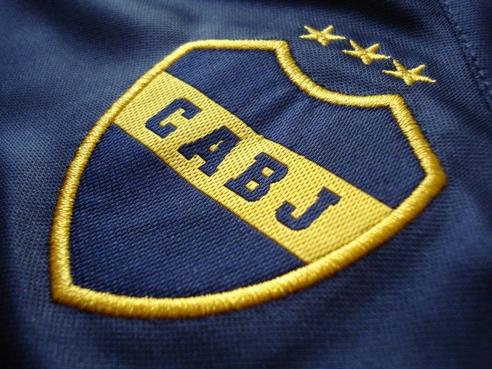 Close-up of Boca Juniors embroidered crest on blue sportswear