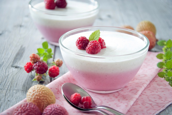 Raspberry and milk dessert with fresh berries