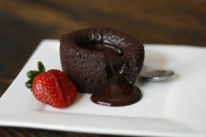 Chocolate lava cake with strawberry and spoon