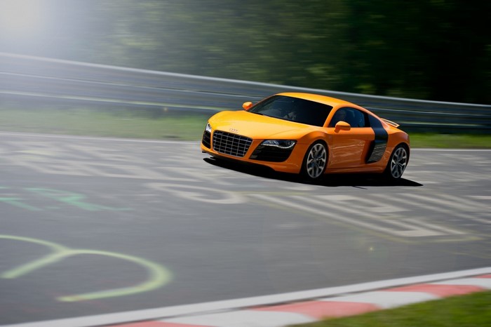 Orange Audi R8 sports car on a race track