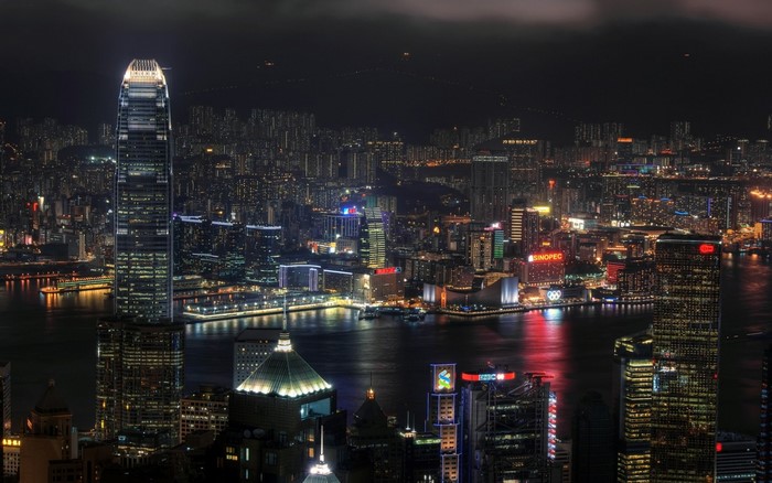 Hong Kong cityscape at night with illuminated skyscrapers